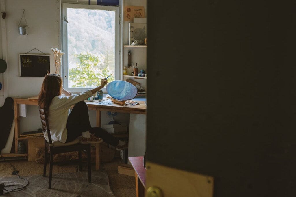 A Woman Doing a Surfboard Painting